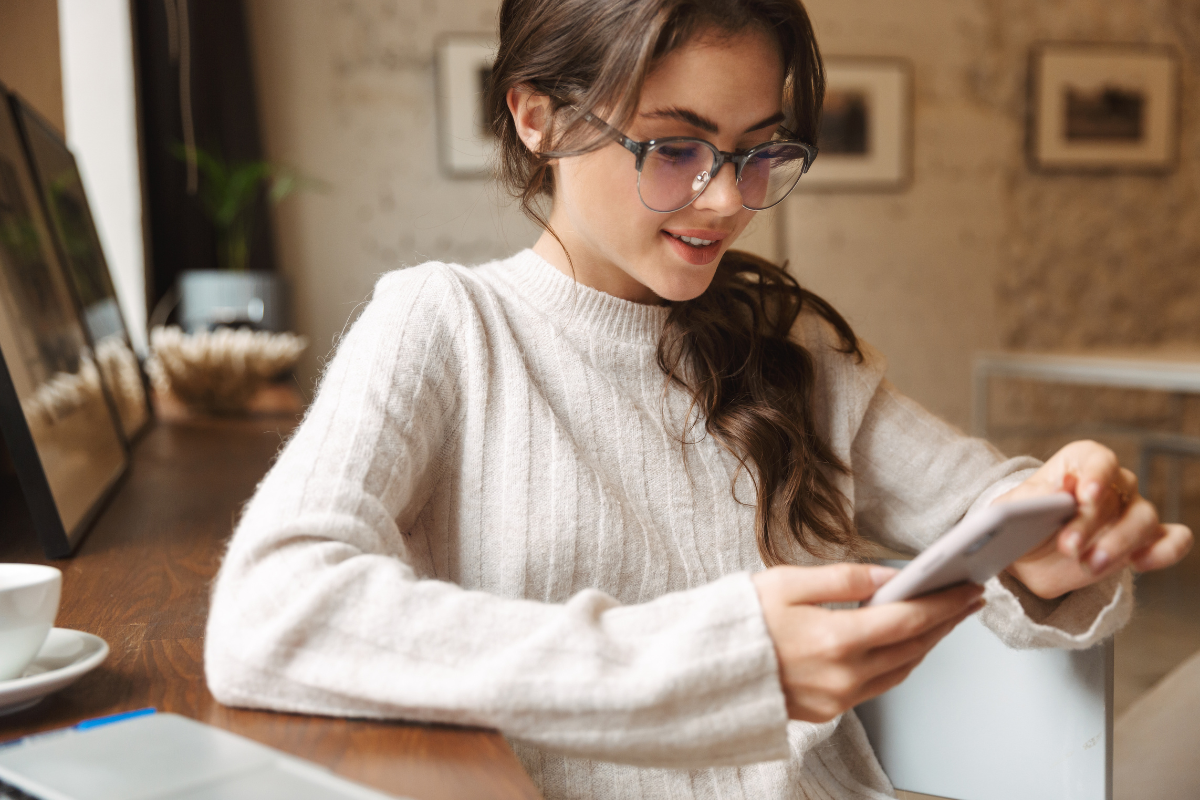 Woman texting a business