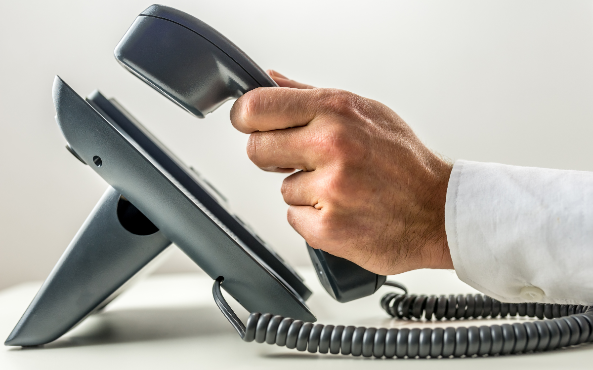 man picking up a business phone