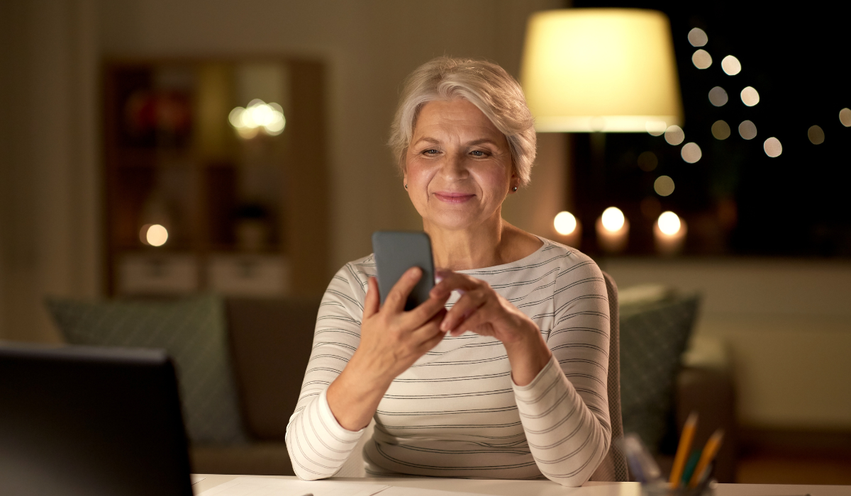 Woman reading a text from a business