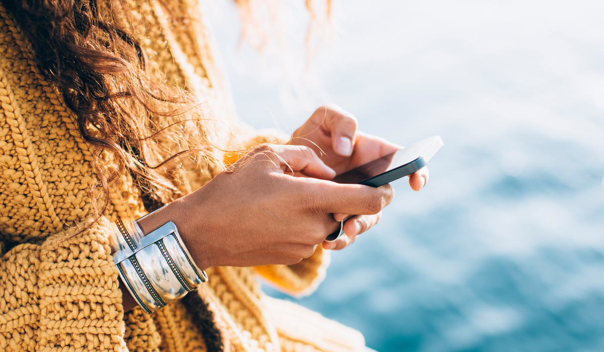 woman texting a small business