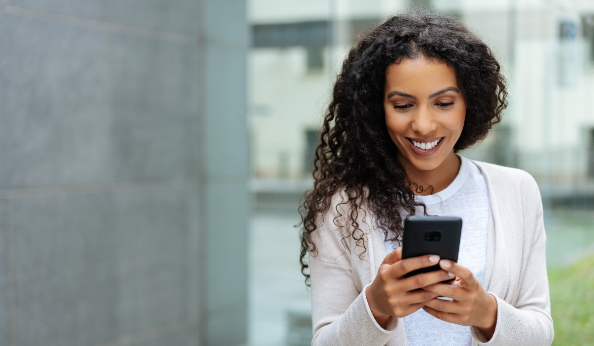 Woman texting a business - user engagement